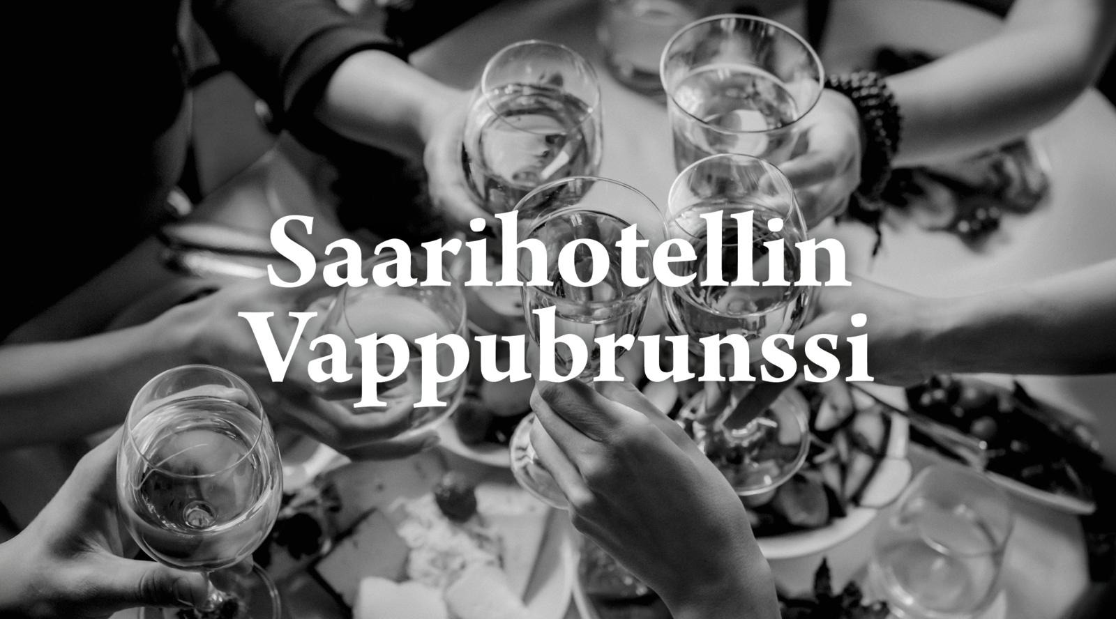 Mustavalkoinen kuva ryhmästä kippistelemässä pöydän yläpuolella.