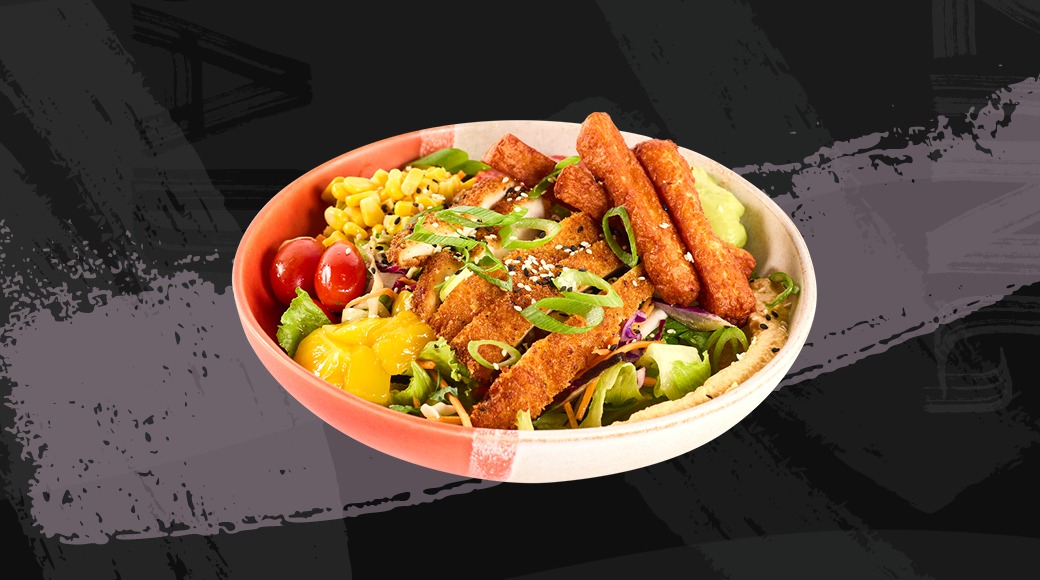 Bowl with salad, corn kernels, cherry tomatoes, bell pepper and breaded tofu strips.