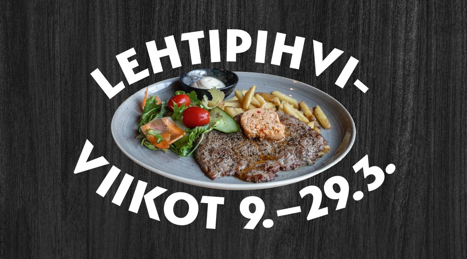 Naudan lehtipihviannos lautasella tummalla puutaustalla.