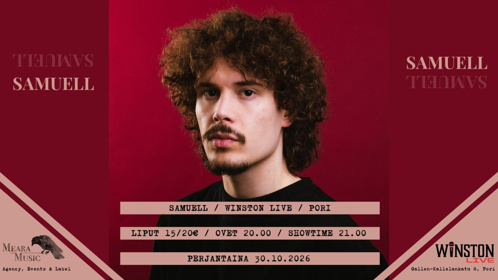 Person with dark curly hair and mustache looks toward the camera against a red background.