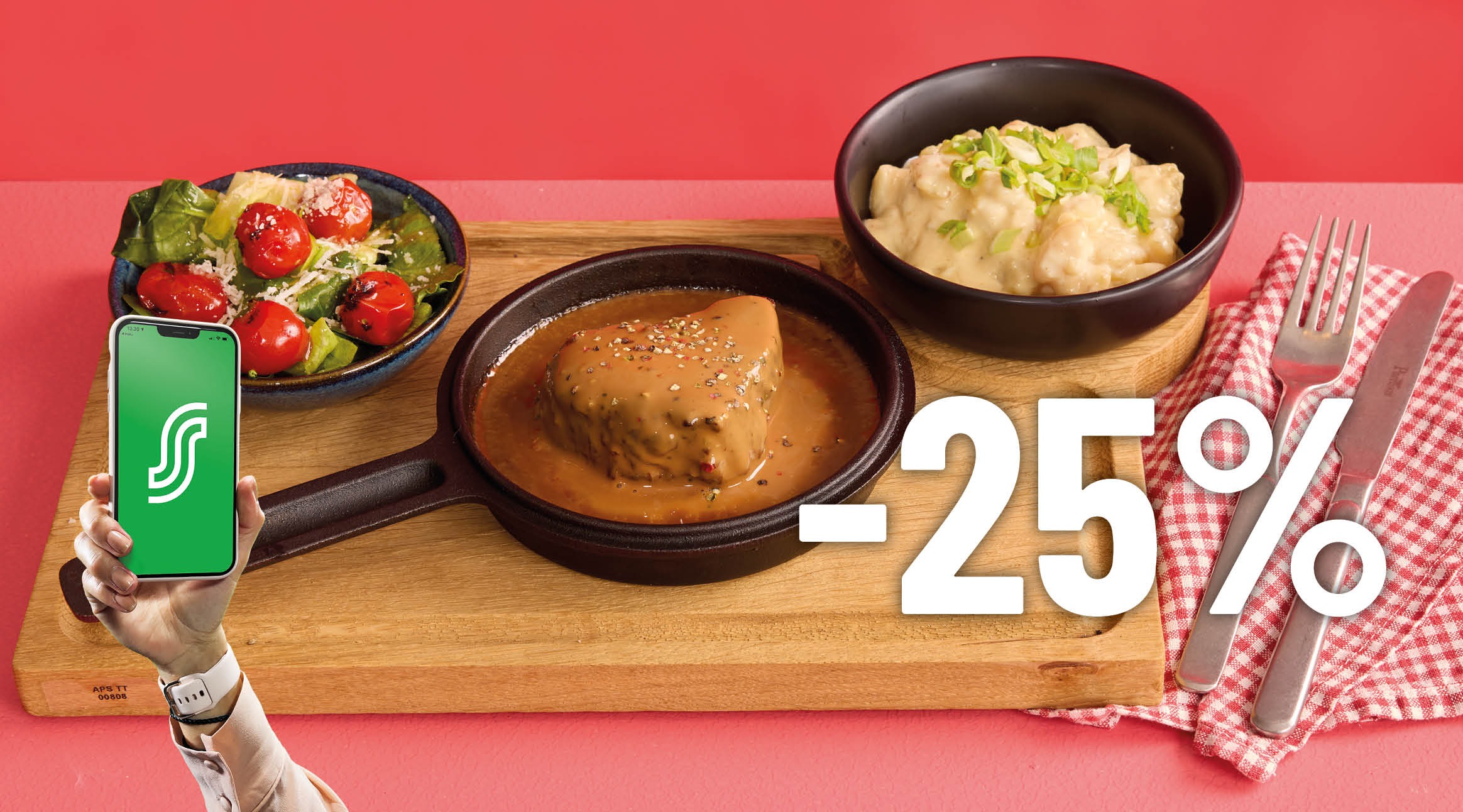 Meal on wooden serving board: steak in sauce, mashed potatoes, and tomato salad. A hand holding phone with app logo on the left.