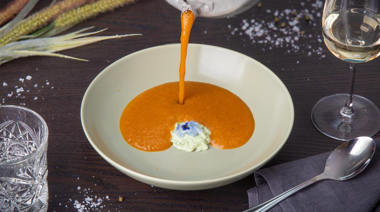 Sea buckthorn and carrot soup with herb mousse