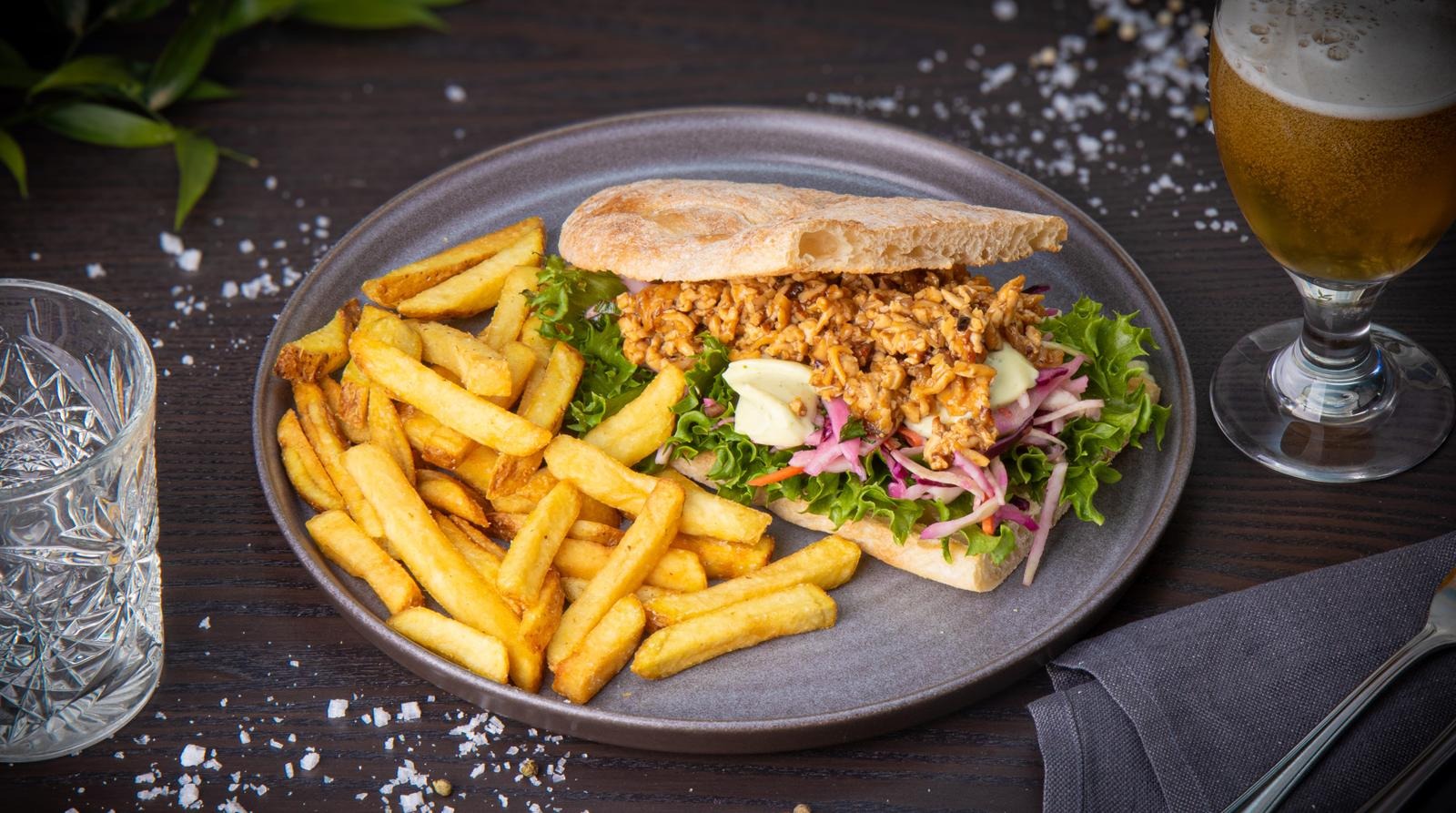 Pulled tofu sandwich, herb mayonnaise, coleslaw and country fries