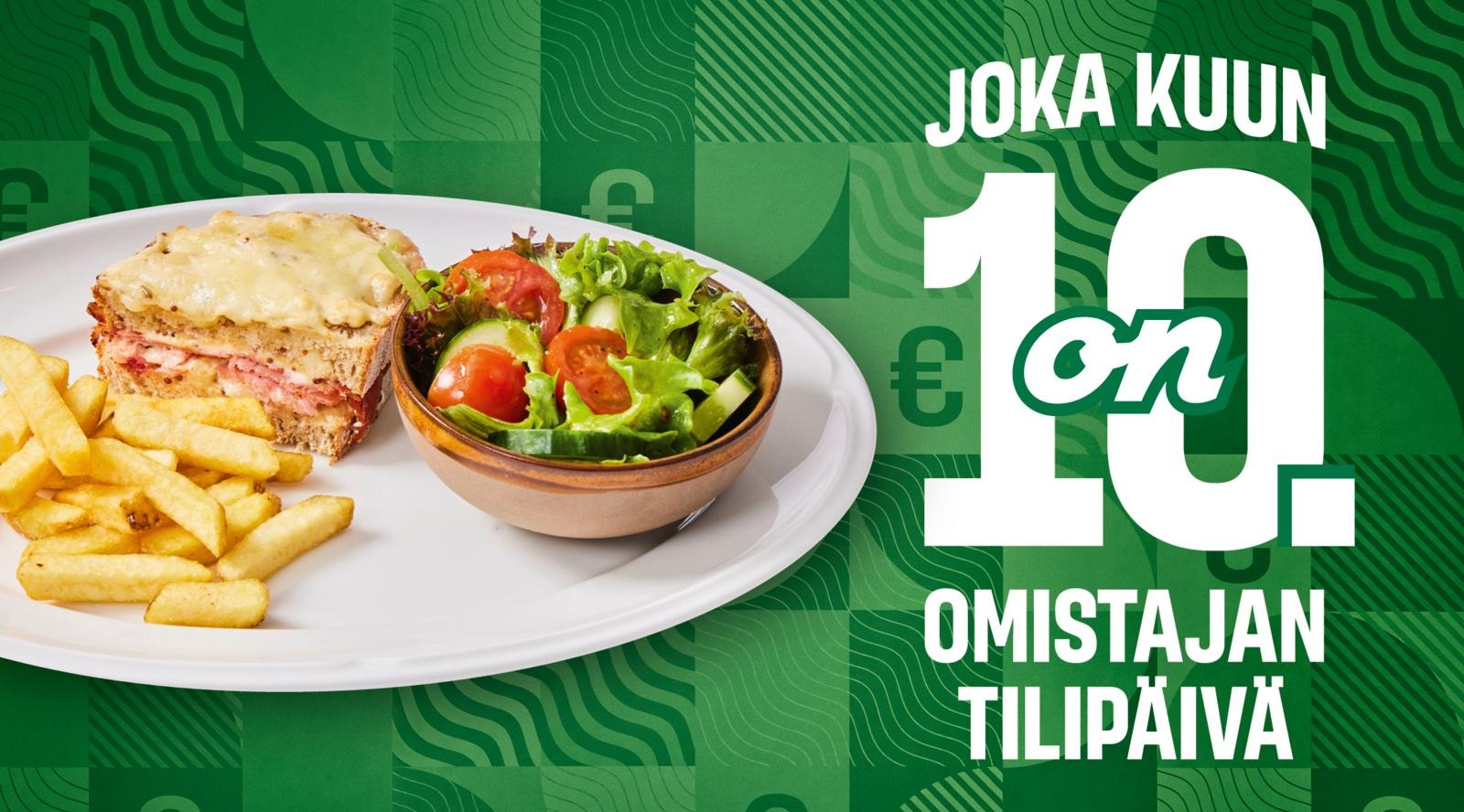 Ranskalaisia, salaattia ja lämmin voileipä vihreällä kuviotaustalla.