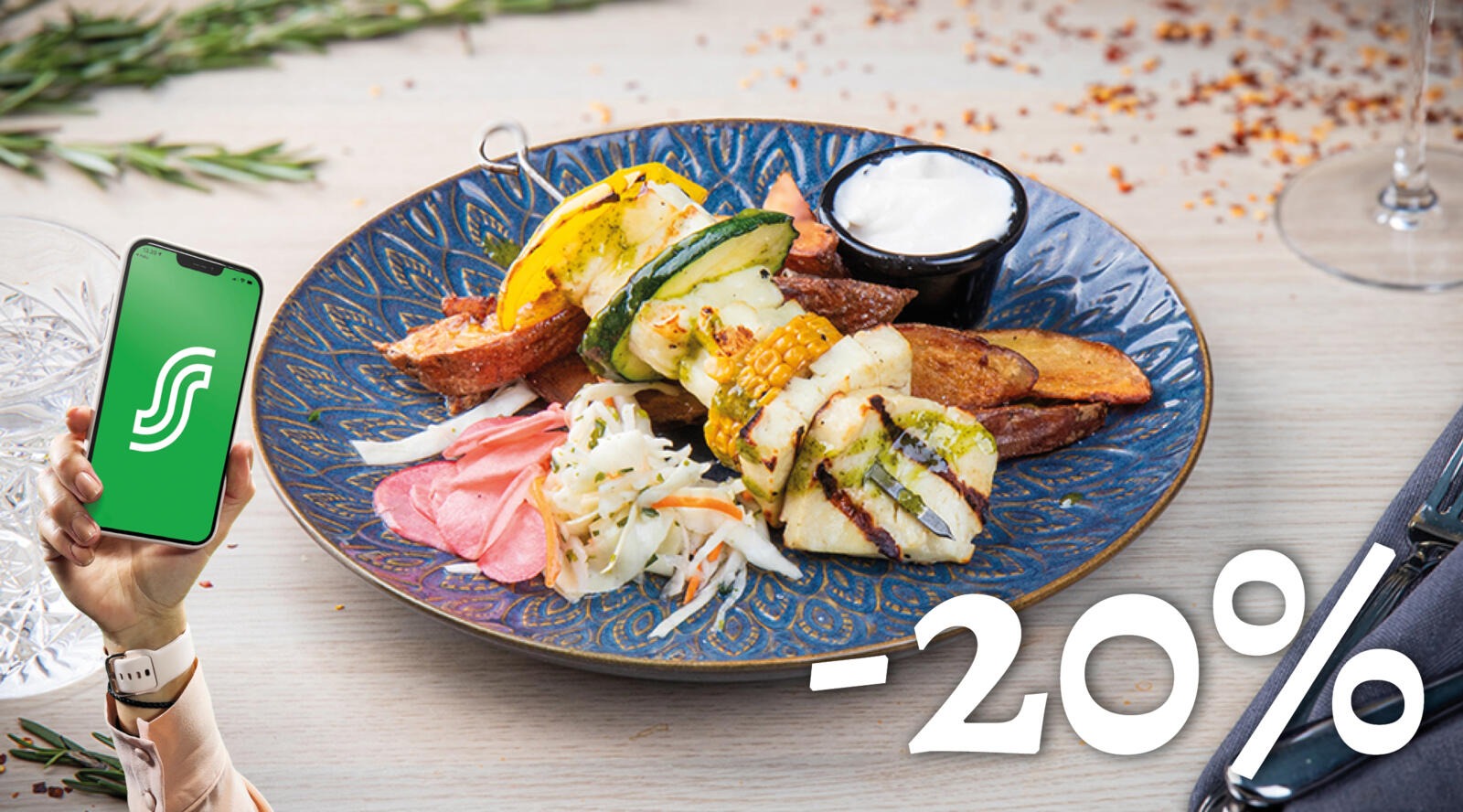 Grilled vegetables, potatoes, salad and dipping sauce on a blue plate.