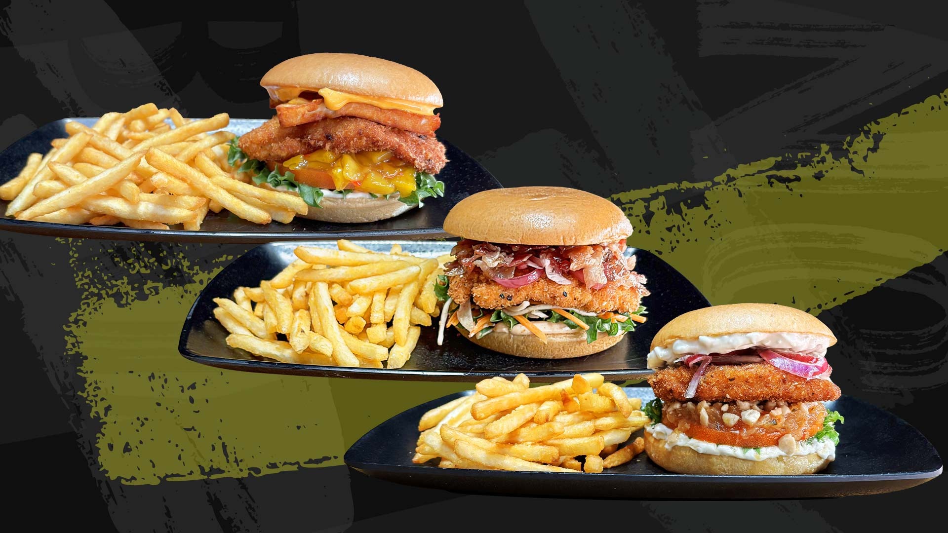 Three burgers served with french fries on black plates, each featuring crispy fried fillings with different toppings.