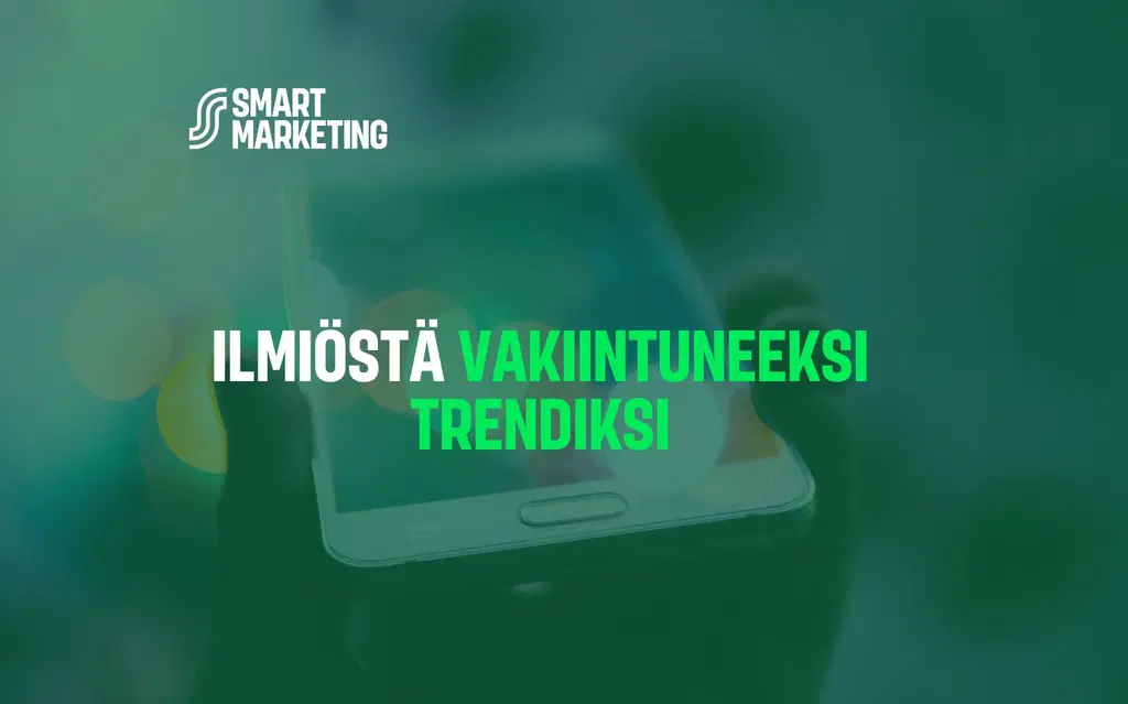 Vihreä tausta älypuhelimella, jonka päällä lukee: ilmiöstä vakiintuneeksi trendiksi.