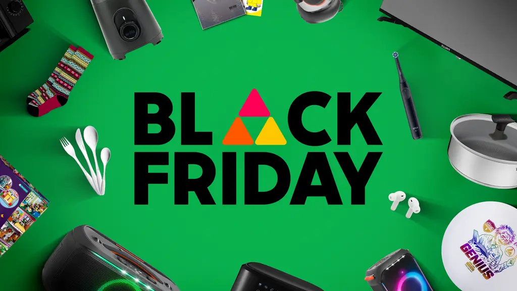 Black Friday -teksti ja käyttötavaroita vihreällä pohjalla.