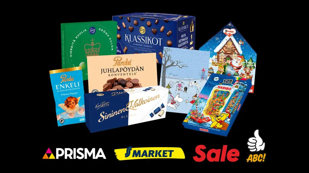 Valikoima joulumakeisia mustalla taustalla.