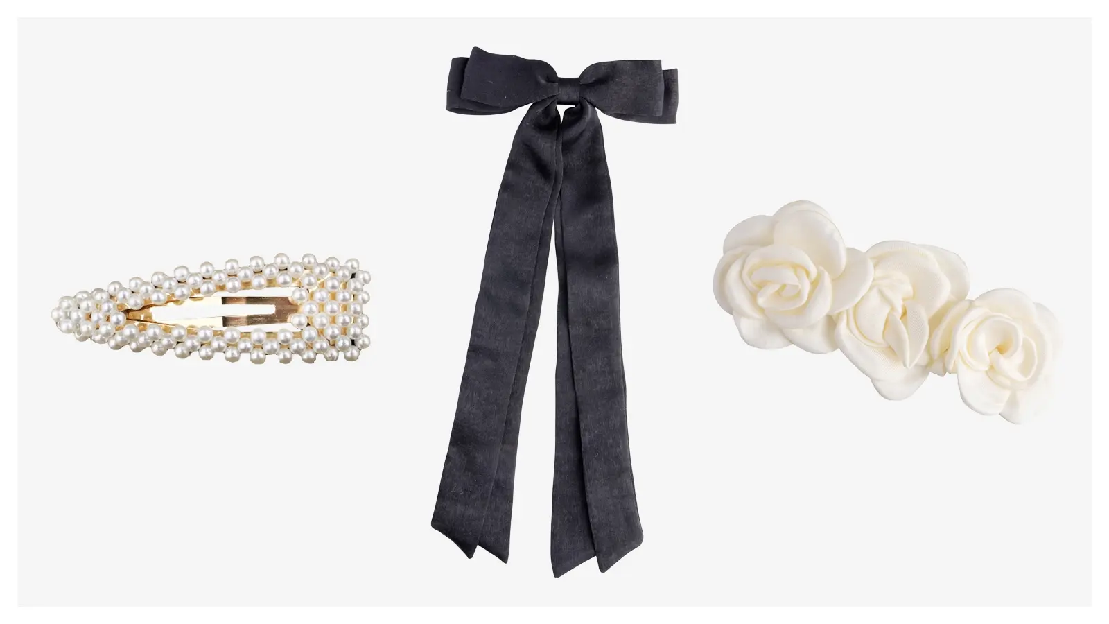 Valkoinen helmihiussolki, musta satiinirusettihiussolki ja hiussolki, jossa on kolme valkoista kangasruusua rivissä.
