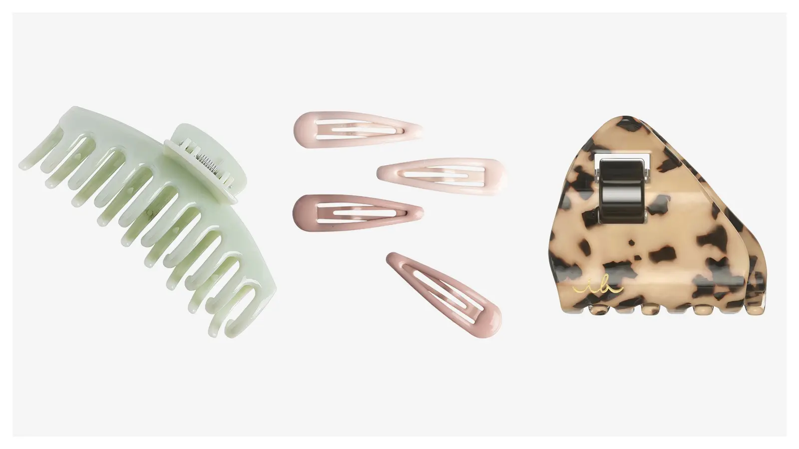 Mintunvihreä hainhammas, haaleanpunaisia ja vanhan roosan värisiä pinnejä sekä leopardikuvioinen hiusklipsi.