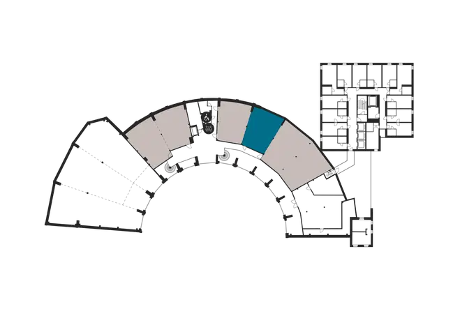 Floor plan of a curved building with combined office and residential spaces. One space highlighted in blue.